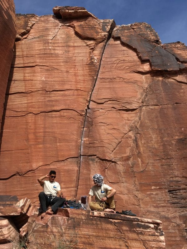 Rock Climbers sitting below Atman at Red Rock, Nevada