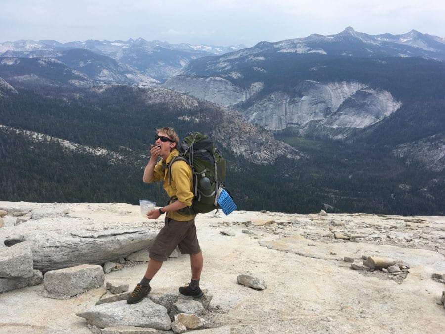 Backpacker on top of Half Dome