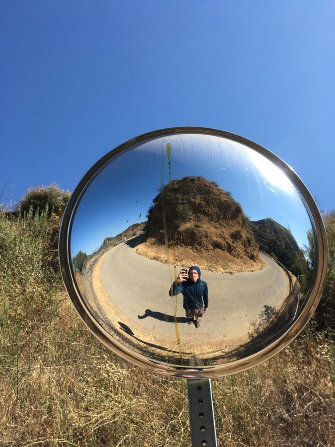 Taking a Selfie in a road mirror near the Hollywood Sign
